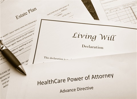 picture of various estate planning document cover sheets lying in a pile